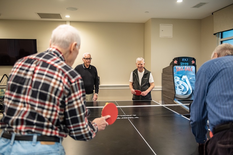 Game Room Men Playing Ping-Pong